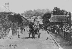 Carriage coming up the High Street circa 1920